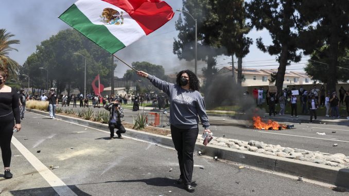 Protesters and federal agents clash after ICE raid in Paramount